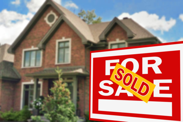 Remodeling Tips for Selling a Home Beautiful home with for sale sign in foreground